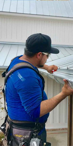 gutter guy picture of gutter worker fiixing a gutter